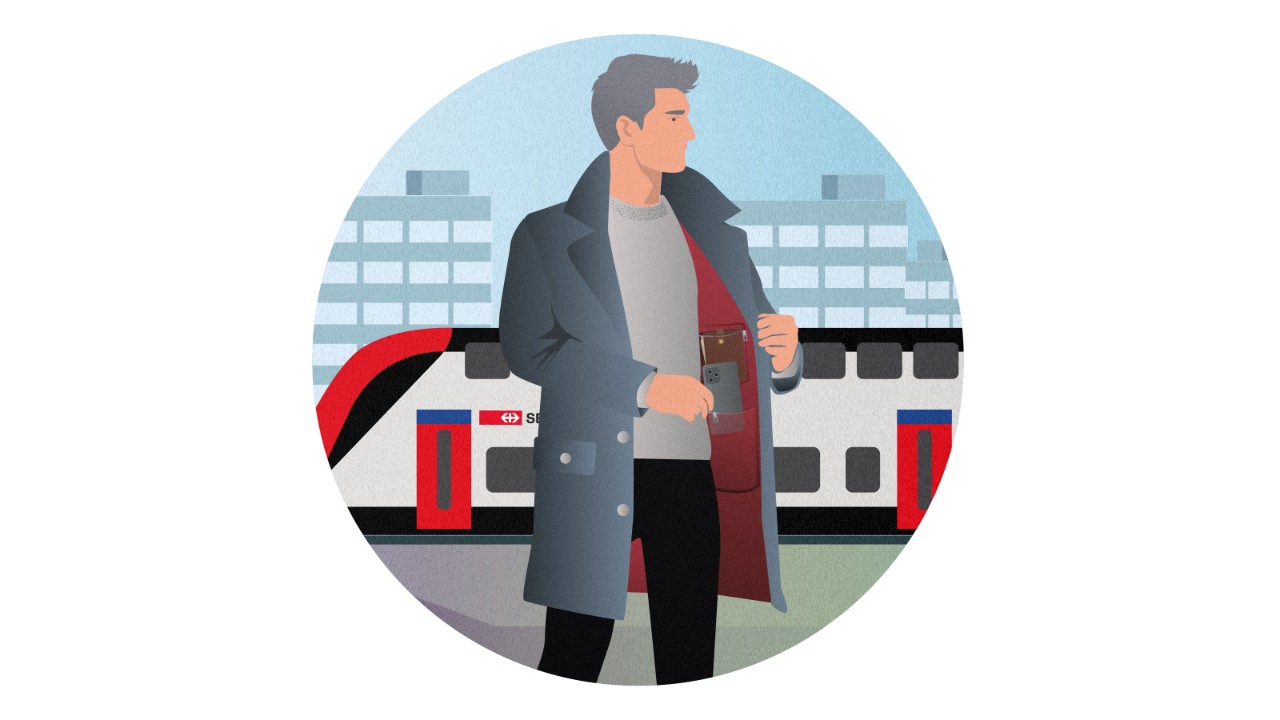 Un homme tient son manteau. Dans les poches intérieures du manteau, on peut voir un porte-monnaie et un smartphone.