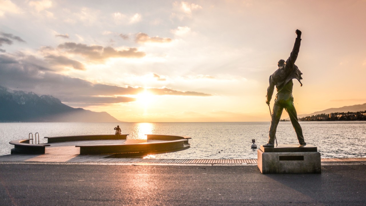 A sunset view of the lake from behind the Freddie Mercury statue.