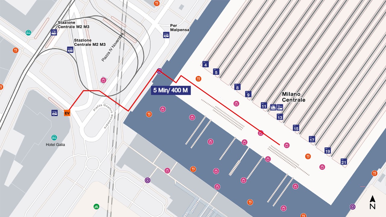 The map shows a bird’s eye view of Milano Centrale railway station, with south at the bottom and north at the top of the map extract. To get to the rail replacement bus, walk from the platform to the head of the station, then towards the main exit. Take the exit on the right towards Piazza IV Novembre and walk to the Hotel Gallia. The distance is about 400 metres and takes 5 minutes to walk.