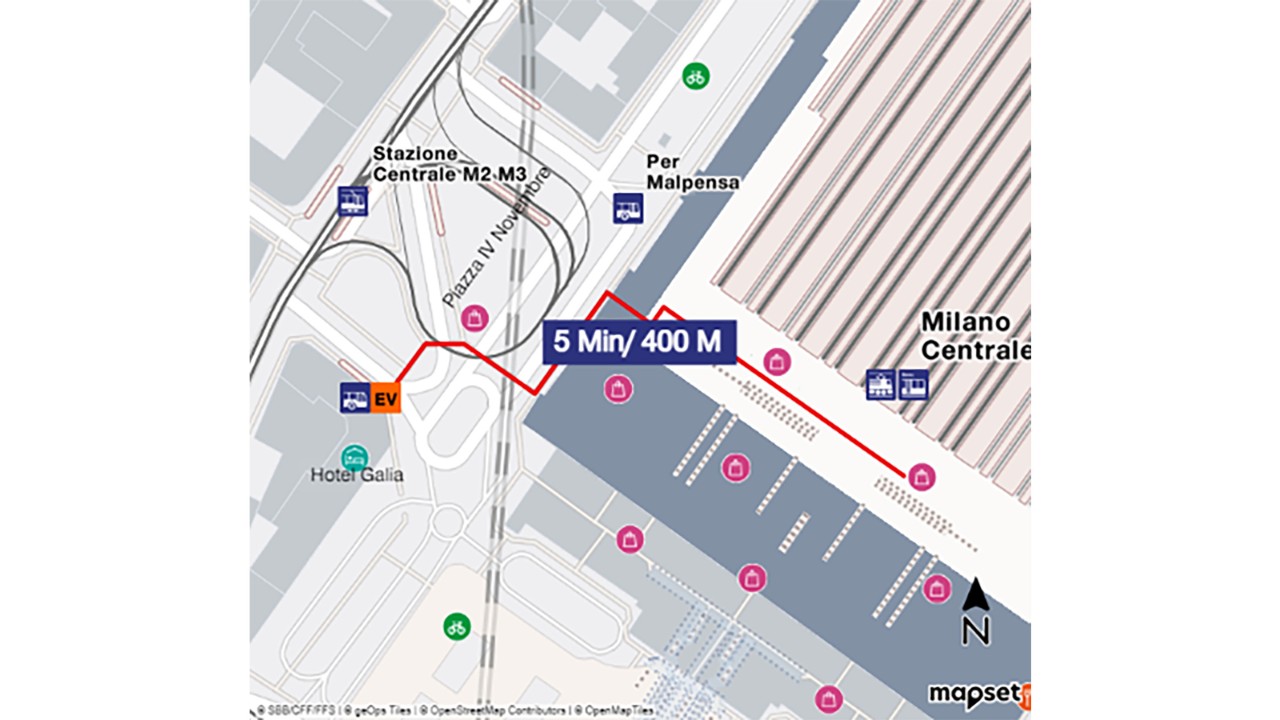 The map shows a bird’s eye view of Milano Centrale railway station, with south at the bottom and north at the top of the map extract. To get to the rail replacement bus, walk from the platform to the head of the station, then towards the main exit. Take the exit on the right towards Piazza IV Novembre and walk to the Hotel Gallia. The distance is about 400 metres and takes five minutes to walk.